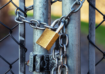  The iron gate with a large chain and a padlock