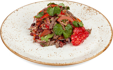 Salad with tomatoes, onions and beef on a plate on a white background
