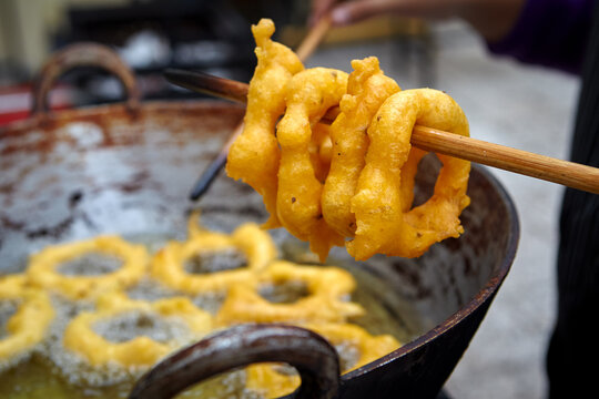 Peruvian picarones are a traditional dessert commonly found in Peru. They are a type of doughnut made from a sweet potato and pumpkin batter, which is deep-fried until golden brown