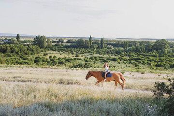 A girl rides a horse