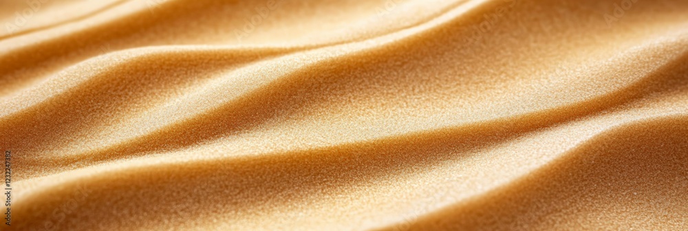 Poster smooth, undulating golden sand dunes create a mesmerizing wavy pattern, evoking a miniature desert l