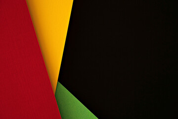 Abstract geometric black, red, yellow, green color background. Colorful papercut layout background