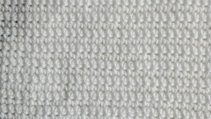 Crochet white wool cashmere background. Close up
