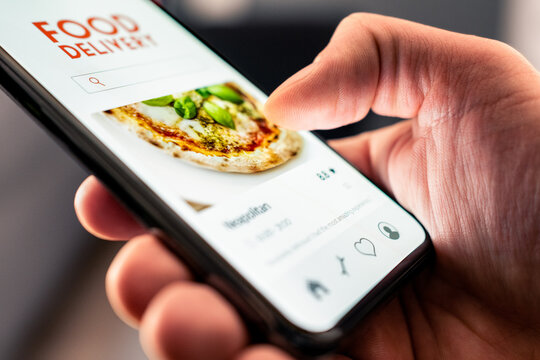 Food and pizza delivery with phone from restaurant. Online app order. Take away menu on website. Quick takeout service. Deliver home fast. Smartphone application in screen.