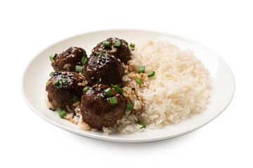 Delicious rice with meatballs, sauce and green onions isolated on white