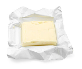 Block of tasty butter in open package isolated on white