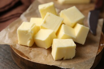 Pieces of fresh butter on table, closeup