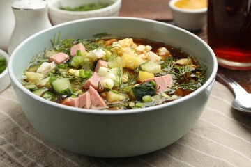 Delicious okroshka soup with kvass served on table, closeup