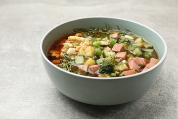 Delicious okroshka soup with kvass on light table