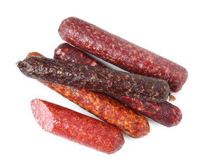 Many different smoked sausages isolated on white, top view