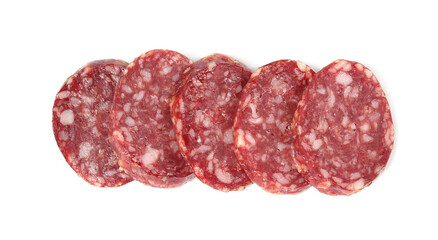 Pieces of delicious dry cured sausage isolated on white, top view