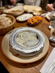 Yuvalama soup turkish traditional food with yogurt or yoghurt and lamb meat