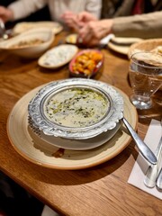 Yuvalama soup turkish traditional food with yogurt or yoghurt and lamb meat