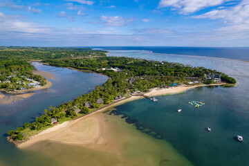 Aerial view above 5 star luxury beach and resort pool in Fiji