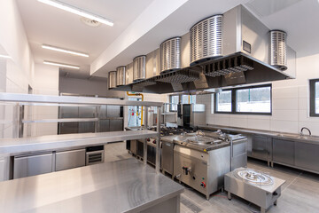 Modern kitchen with stainless steel, efficient layout, and bright, inviting lighting
