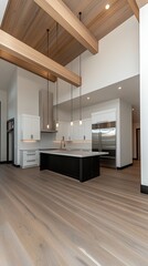 Bright and spacious kitchen showcases stainless steel appliances and a contemporary island counter, perfect for cooking and entertaining