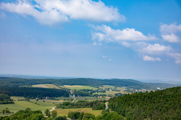A breathtaking scenic landscape showcasing rolling hills under a vibrant blue sky