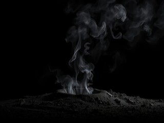 Dark smoke rises from a small crater in the ground on a black background, desert landscape, natural disaster