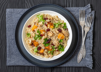 quinoa pumpkin salad in a bowl, top view