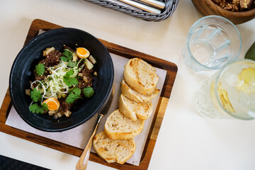 Gourmet beef tartare with toast slices