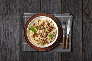 beef and rice in white bowl, top view