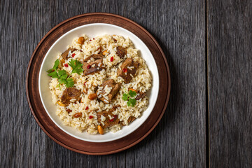 beef and rice in white bowl, top view
