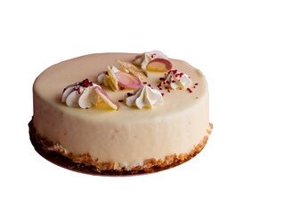 A round cake features a smooth, creamy white frosting topped with small swirls of whipped cream and colorful sprinkles, set against a plain background.