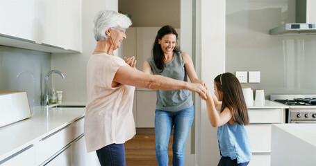 Mother, daughter and grandmother with dancing in home for celebration, bonding or connection. Energy, women or kid in circle in kitchen with moving together for weekend entertainment, love or support