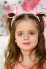 little girl with a valentine's day heart