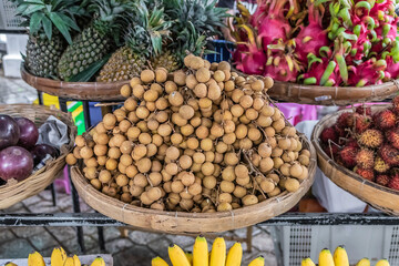 Exotic and seasonal tropical fruits longan at market in Asia