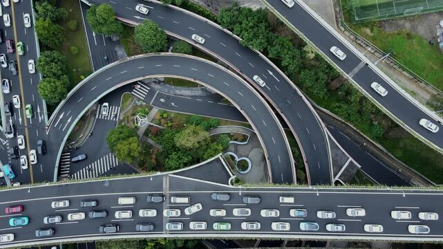 Drone shot of a large interchange in the heart of Chengdu, China. Heavy traffic and congestion.