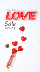 Advertising poster with the word Love along with a small bottle with red hearts pouring out of it.