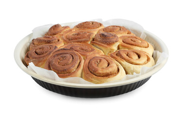Freshly baked cinnamon rolls in baking dish isolated on white
