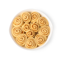 Raw cinnamon rolls in baking dish isolated on white, top view
