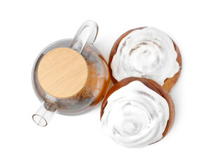 Tasty cinnamon rolls with cream and tea isolated on white, top view
