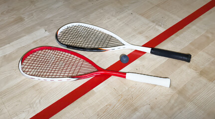 Sports, above and racket on squash court for competition, challenge and training center. Exercise, interior and empty room with top view of wooden floor of gymnasium for games, fitness club and gear