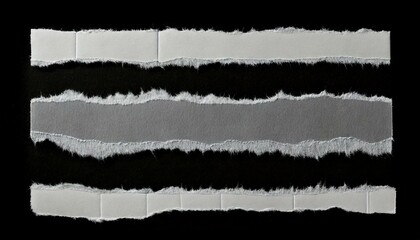 Ripped torn paper edges isolated on black background