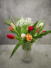 Vibrant bouquet of tulips in a glass vase, celebrating valentine's day in prague, czechia