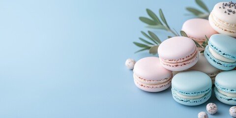 A blue and pink macaron tower with a green leaf on top