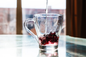 Red Hibiscus tea in the cup. Karkade tea for ramadan celebrations 