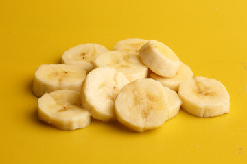 sliced ​​bananas on yellow background