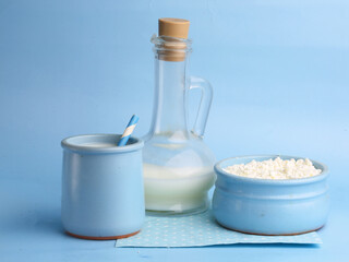 set of dairy products on a blue background