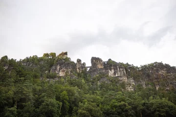 Bastei bridge seen from the Elbe river. Building in between the sandstones of the Saxon Switzerland. Tourist attraction in Saxony. Beautiful nature in Germany.