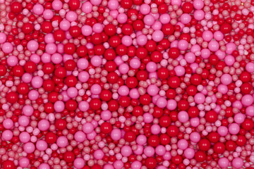 Valentine-themed Red and Pink Sugar Pearls Background - Romantic Decorative Sprinkles Pattern for Cake Decorating and Holiday Baking - Macro Food Photography