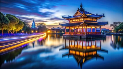 Fototapeta premium Ancient Jiangsu's Wenchang Pavilion glows in long-exposure night photography; stunning scenic views for the travel album.