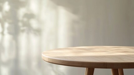 Empty round wood table on beige gray wall background. Wooden rustic podium. Oak nature stand product display. Modern minimal cosmetic design