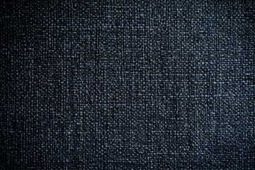 Dark fabric background for fashion photography. Deep-toned texture ideal for showcasing apparel designs and textile products. Perfect for clothing and fabric presentations