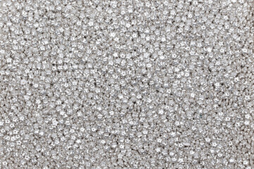 Sparkling Silver Glitter Texture Background - Luxurious Shimmering Pattern for Wedding and Holiday Decorations - Close-up Macro Photography of Metallic Surface