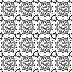 seamless pattern features intricate, symmetrical mandala designs in black and white, creating a repetitive and ornate geometric floral motif ideal for decorative purposes