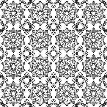 seamless pattern features intricate, symmetrical mandala designs in black and white, creating a repetitive and ornate geometric floral motif ideal for decorative purposes